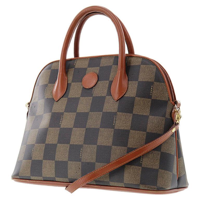 Authentic FENDI Check Hand Bag: Brand: Fendi Material: PVC Leather Style: Hand Bag Color: Brown Size(Inch): H 10.2 x D 5.5 x L 13.7 Handle. 13.3 Country of Origin: Italy Come with: - All Bidhaus items come with a 100% money-back aut