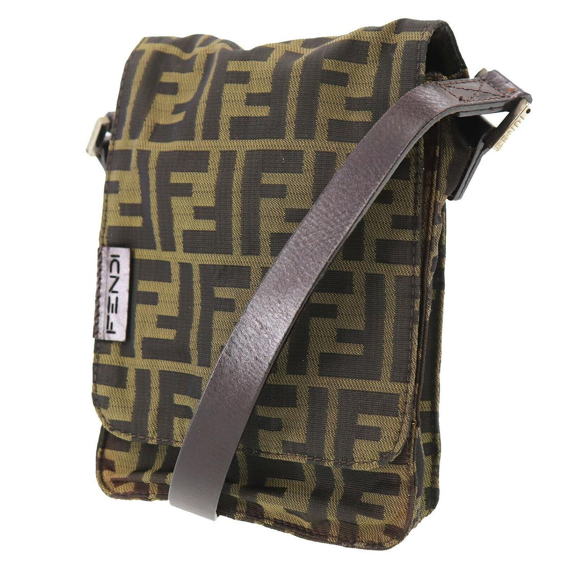 Authentic FENDI Zucca Pattern Shoulder Bag: Brand: Fendi Material: Canvas Style: Shoulder Bag Color: Brown Black Size(Inch): H 7.4 x D 1.5 x L 5.5 Shoulder : 36.6 - 38.9 Country of Origin: Italy Come with: - All Bidhaus items come with a 100% m