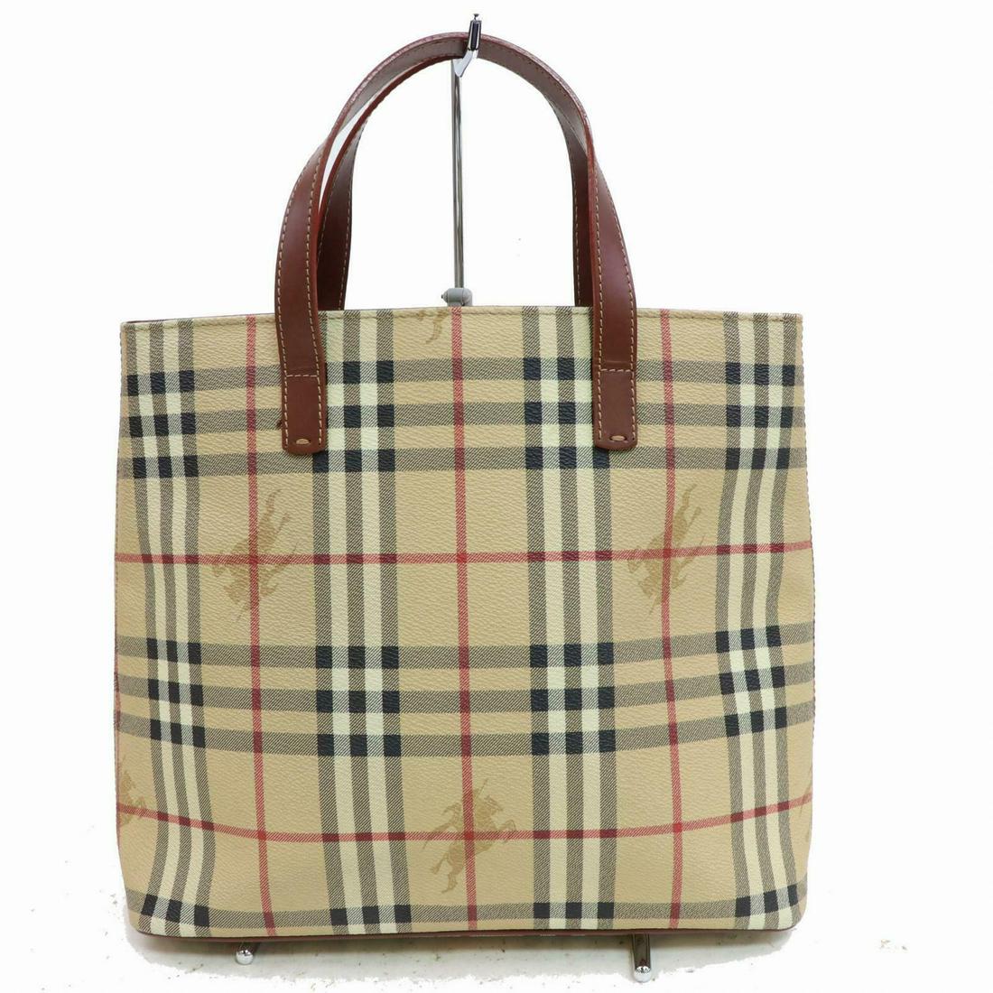 Authentic BURBERRY London PVC Hand Bag: Brand: BURBERRY London Material: PVC Style: Hand Bag Color: Beiges All Bidhaus items come with a 100% money-back authenticity guarantee. Please refer to images carefully for condition details. Unless