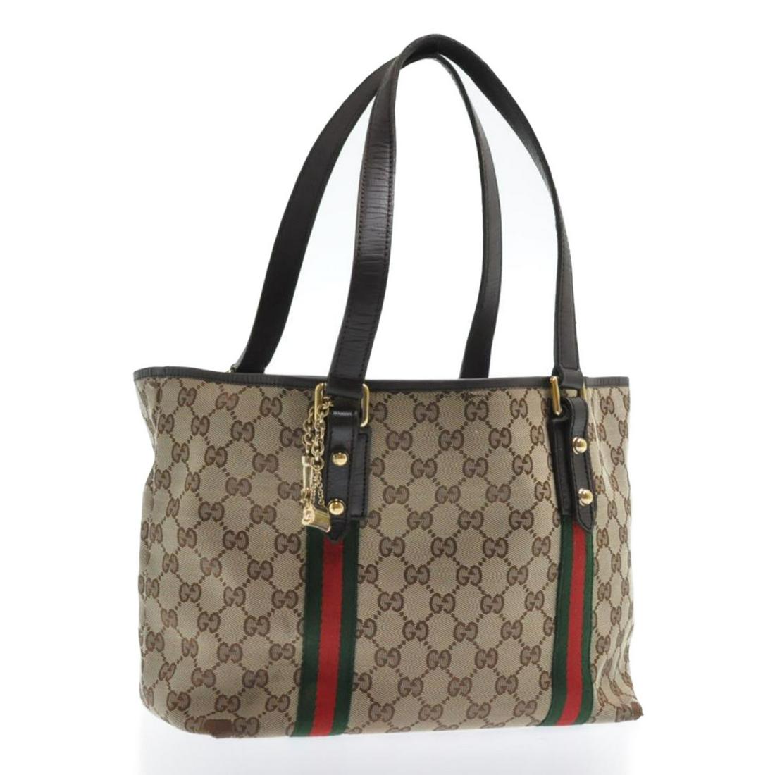 Authentic Gucci Web Sherry Line Gg Canvas Tote Bag Red: Brand: Gucci Style: Tote Bag Material: Canvas Color: Beige Size (Inches): W10.62 X H8.66 X D5.51Inch(Approx) Exterior Condition: Canvas : Minor Stain, Rubbing, Partial Tear Handle : Rubbing, Wrinkle, 