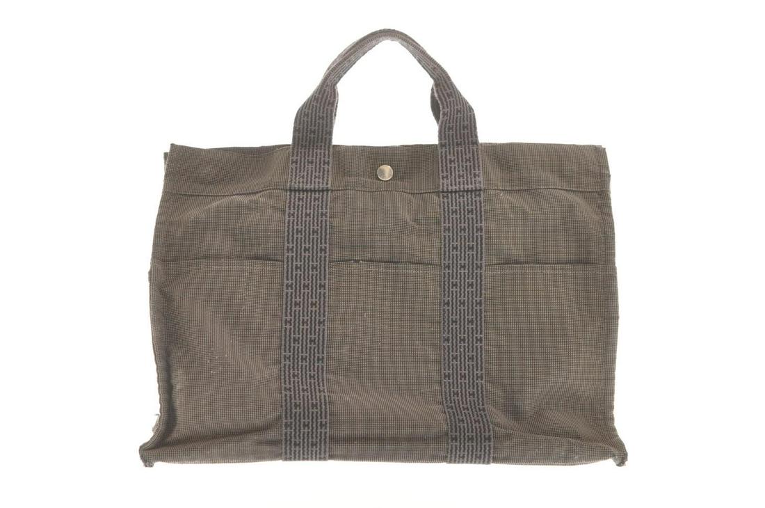 Authentic HERMES Tote Bag: Brand: HERMES Material: 69% polyamide / 31% Polyester Style: Tote Bag Color: Gray Size(inch): W16.5 x H11.8 x D3.9â€³(Approx) Country of Origin: France Accessory: Padlock(No Keys) All Bidhaus item