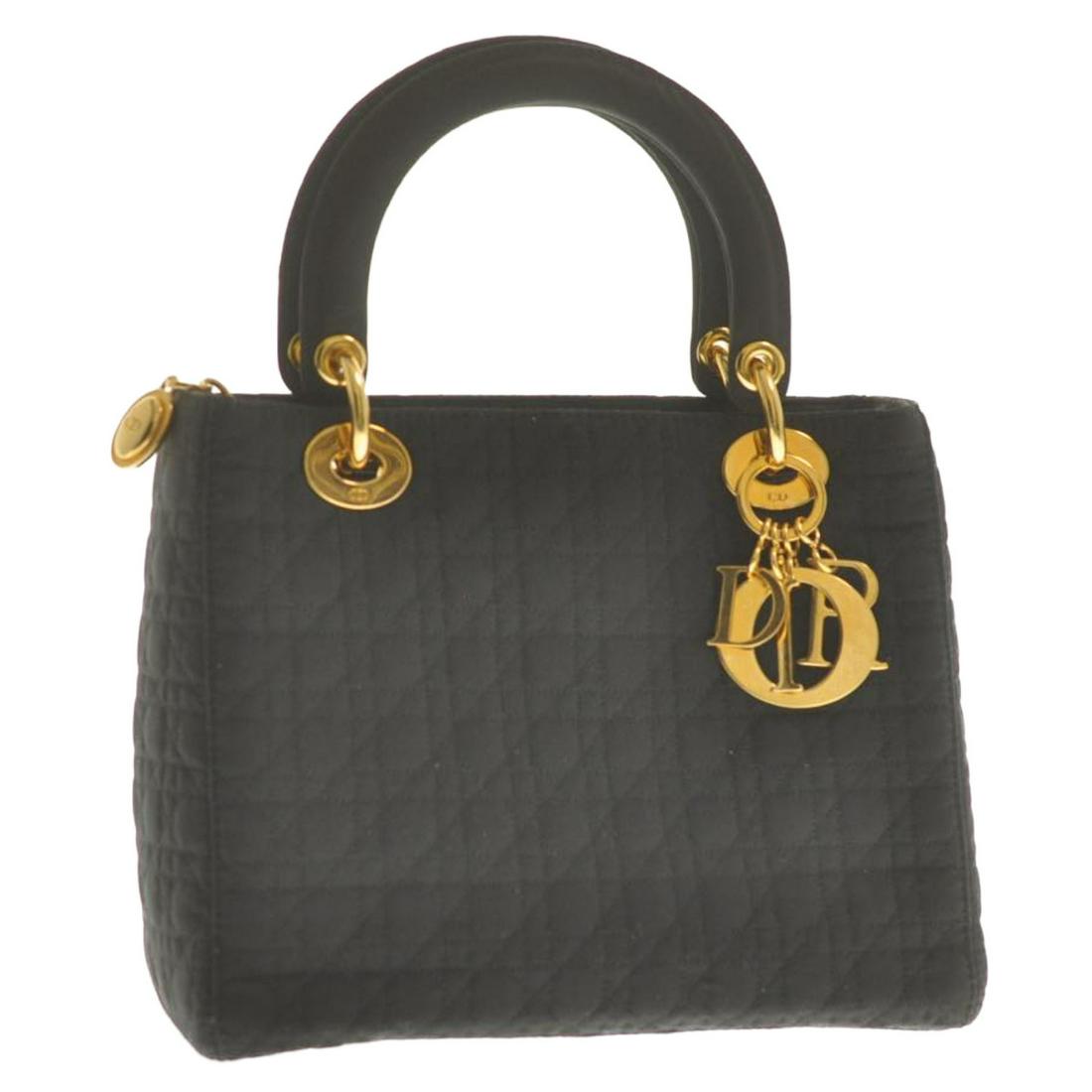 Authentic CHRISTIAN DIOR Nylon Hand Bag: Brand: CHRISTIAN DIOR Material: Nylon Style: Hand Bag Color: Black Size(inch): W9.44 x H7.87 x D3.93inch(Approx) Country of Origin: Italy Accessory: Guarantee Card / Instruction Manual Card All Bidhau