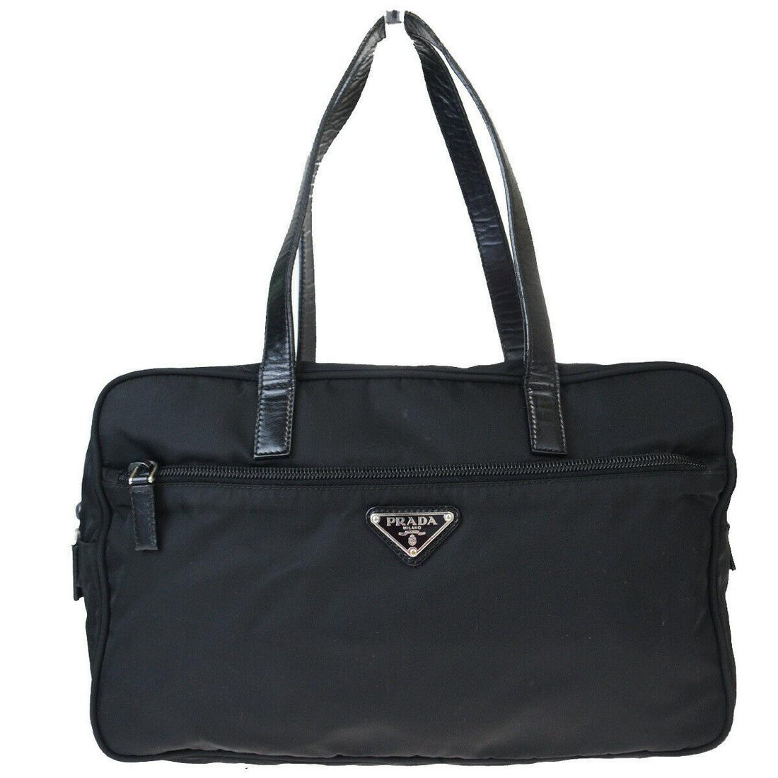 Authentic PRADA Nylon, Leather Shoulder bag: Brand: PRADA Material: Nylon, Leather Style: Shoulder bag Color: Black Size (HxWxD): 19cm x 31cm x 10.5cm / 7.48'' x 12.2'' x 4.13'' Country of Origin: Italy All Bidhaus items come with a 100% money-b