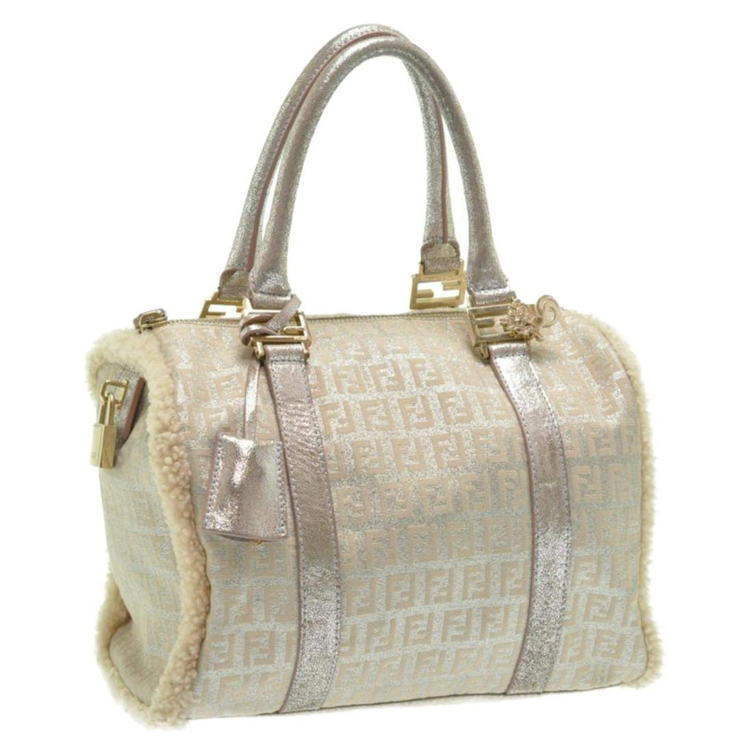 Authentic FENDI Canvas Hand Bag: Brand: FENDI Material: Canvas Style: Hand Bag Color: Brown Size(inch): W10.23 x H7.48 x D5.9inch(Approx) Country of Origin: Italy Accessory: Padlock/ KeyÃ—2 All Bidhaus items come with a 100% money