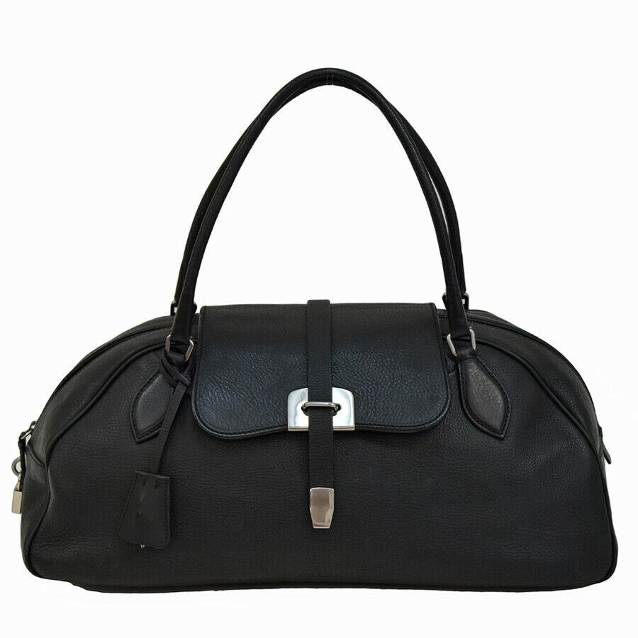 Authentic PRADA Leather Hand Bag: Brand: PRADA Material: Leather Style: Hand Bag Color: Black Size(inch): W:18.1"Ã—H:7.5"Ã—D:7.5" Handle:18.9" Come with: Cadenas, Guarantee, Clochette, Key All Bidhaus items come with a 100% mone