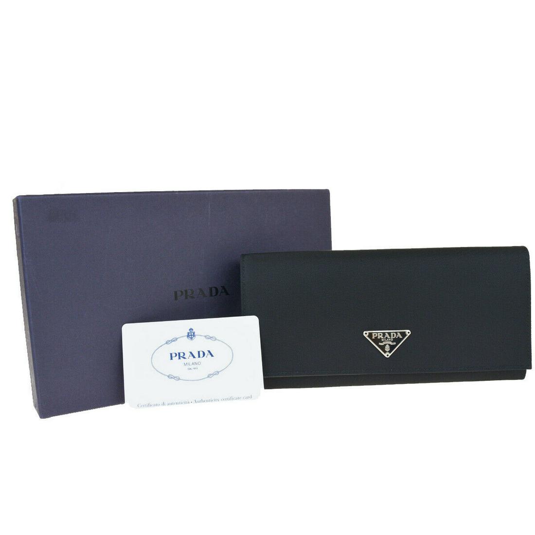 Authentic PRADA Nylon,Leather Wallet: Brand: PRADA Material: Nylon,Leather Style: Wallet Color: Black Size(inch): W 7.5 x H 3.5 x D 0 "(approx.) Country of Origin: Italy Come with: Box,Authenticity Card All Bidhaus items come with a 100%