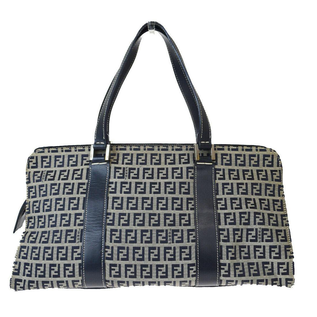 Authentic FENDI Leather, Nylon Hand Bag: Brand: FENDI Material: Leather, Nylon Style: Hand Bag Color: Navy Blue Size(inch): W 14.2 x H 7.1 x D 6.3 "(approx.) Country of Origin: Italy Come with: - All Bidhaus items come with a 100% money-back