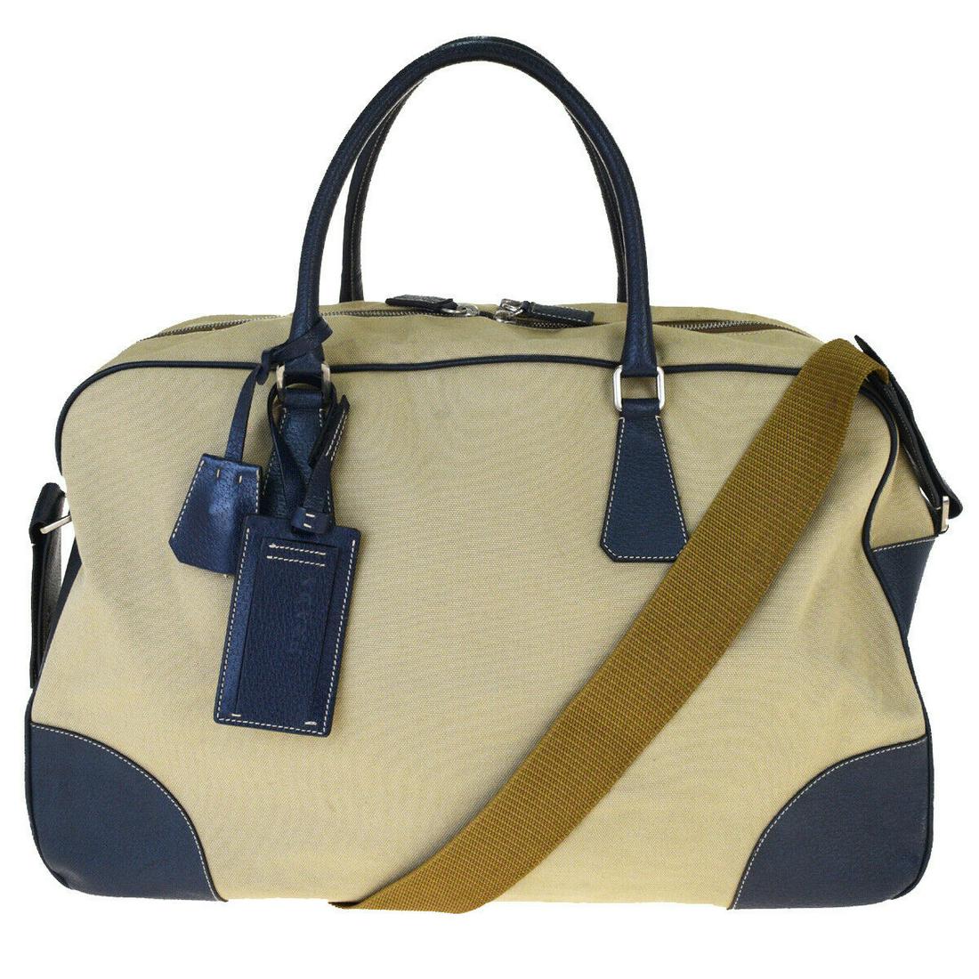 Authentic PRADA Canvas, Leather Shoulder Hand Bag: Brand: PRADA Material: Canvas, Leather Style: Shoulder Hand Bag Color: Beige Navy Blue Size(inch): W 18.5 x H 11.4 x D 7.9 "(approx.) Country of Origin: Italy Come with: Shoulder strap,Padlock,Key*2,K