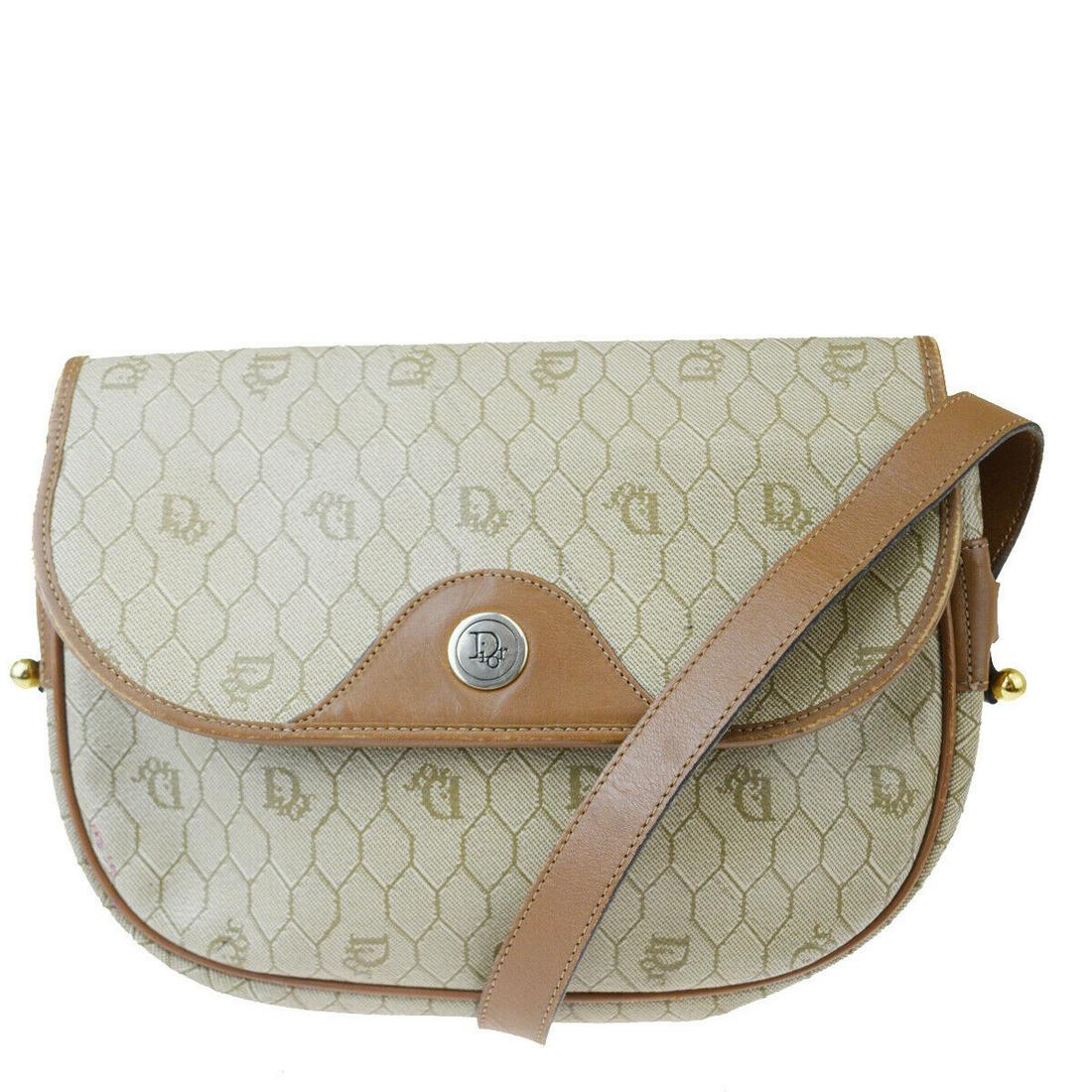 Authentic CHRISTIAN DIOR Leather, PVC Shoulder Bag: Brand: CHRISTIAN DIOR Material: Leather, PVC Style: Shoulder Bag Color: Brown Size(inch): W 9.4 x H 7.1 x D 2.4 "(approx.) Country of Origin: France Come with: - All Bidhaus items come with a 100% mon