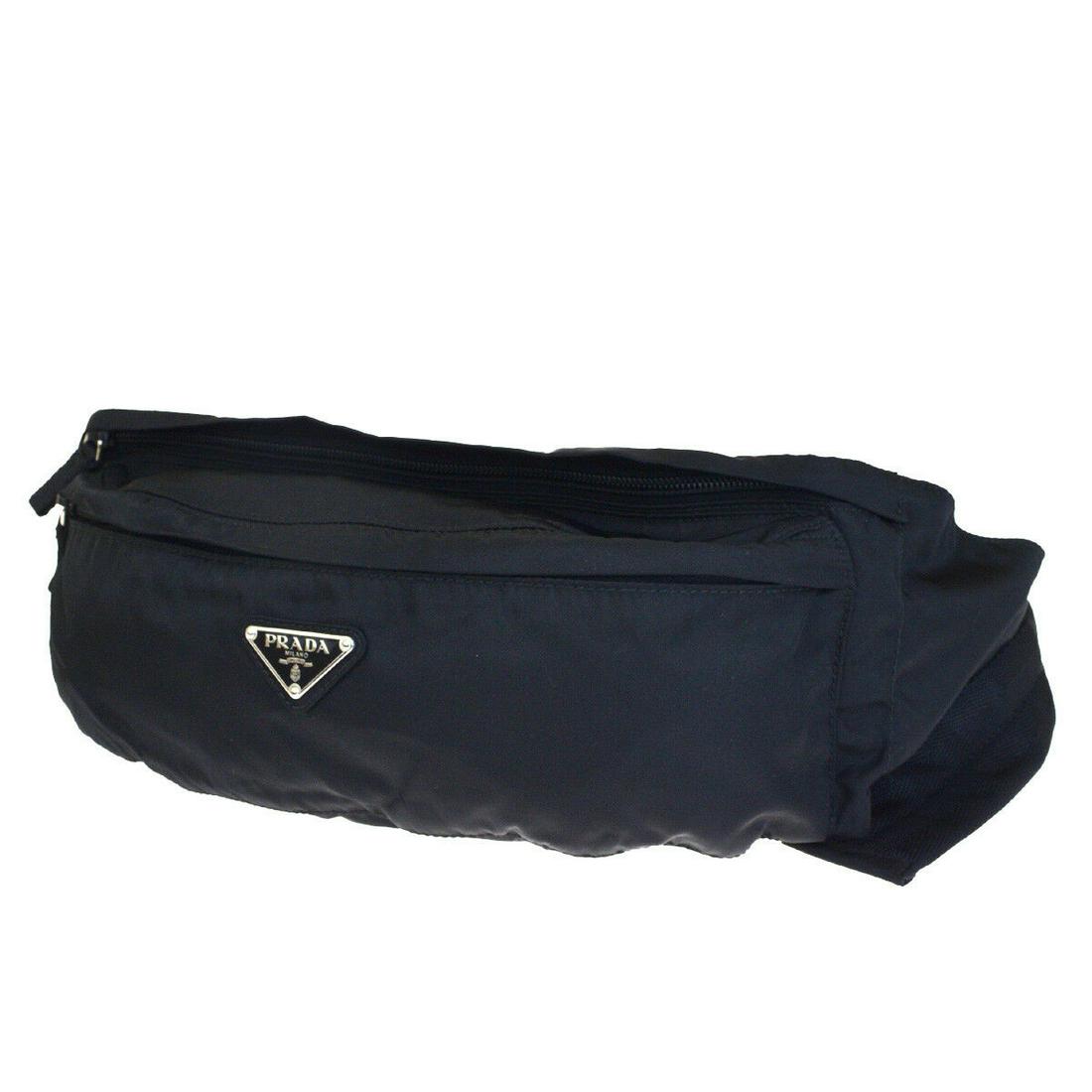 Authentic PRADA Nylon Bum Bag: Brand: PRADA Material: Nylon Style: Bum Bag Color: Black Size(inch): W 11.8 x H 4.3 x D 2 "(approx.) Country of Origin: Italy Come with: - All Bidhaus items come with a 100% money-back authenticity gu