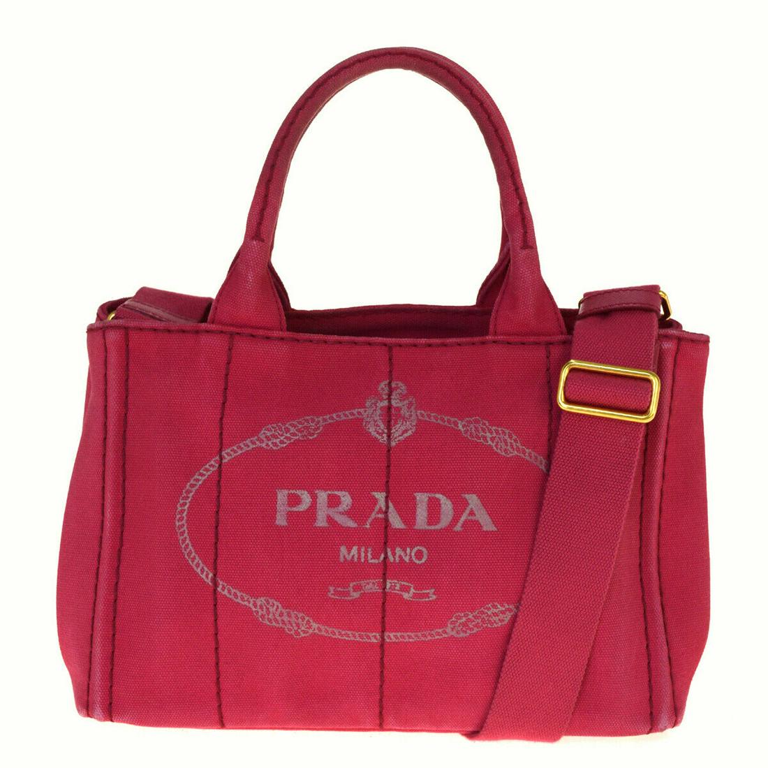 Authentic PRADA Canvas Hand bag: Brand: PRADA Material: Canvas Style: Hand bag Color: Pink Size(inch): W 10.6 x H 7.1 x D 5.5 "(approx.) Country of Origin: Italy Come with: Strap All Bidhaus items come with a 100% money-back authenti