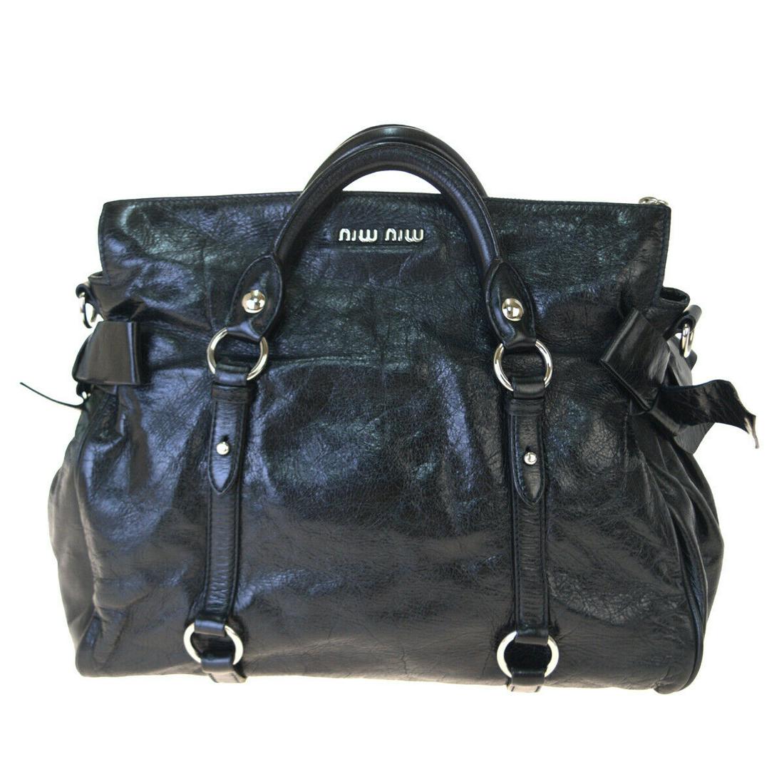 Authentic MIU MIU Leather Hand bag: Brand: MIU MIU Material: Leather Style: Hand bag Color: Black Size(inch): W 11.8 x H 9.4 x D 5.9 "(approx.) Country of Origin: Turkey Come with: - All Bidhaus items come with a 100% money-back authent