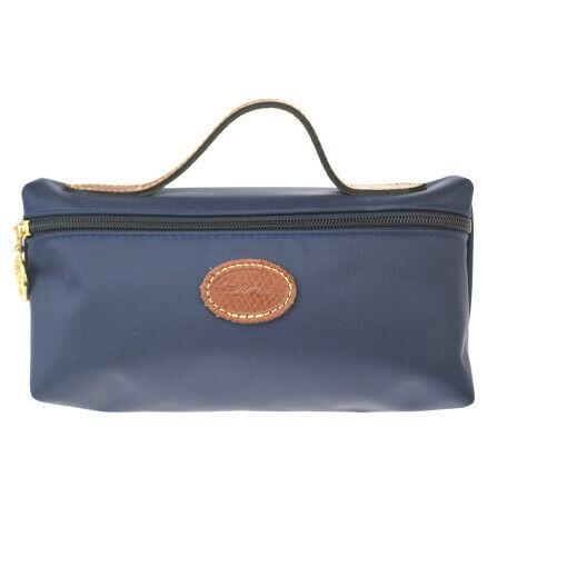 Authentic LONGCHAMP Nylon, Leather Handbag: Brand: LONGCHAMP Material: Nylon, Leather Style: Handbag Color: Navy Size (HxWxD): 9.5cm x 19cm x 6.5cm / 3.74'' x 7.48'' x 2.55'' Country of Origin: China All Bidhaus items come with a 100% money-bac