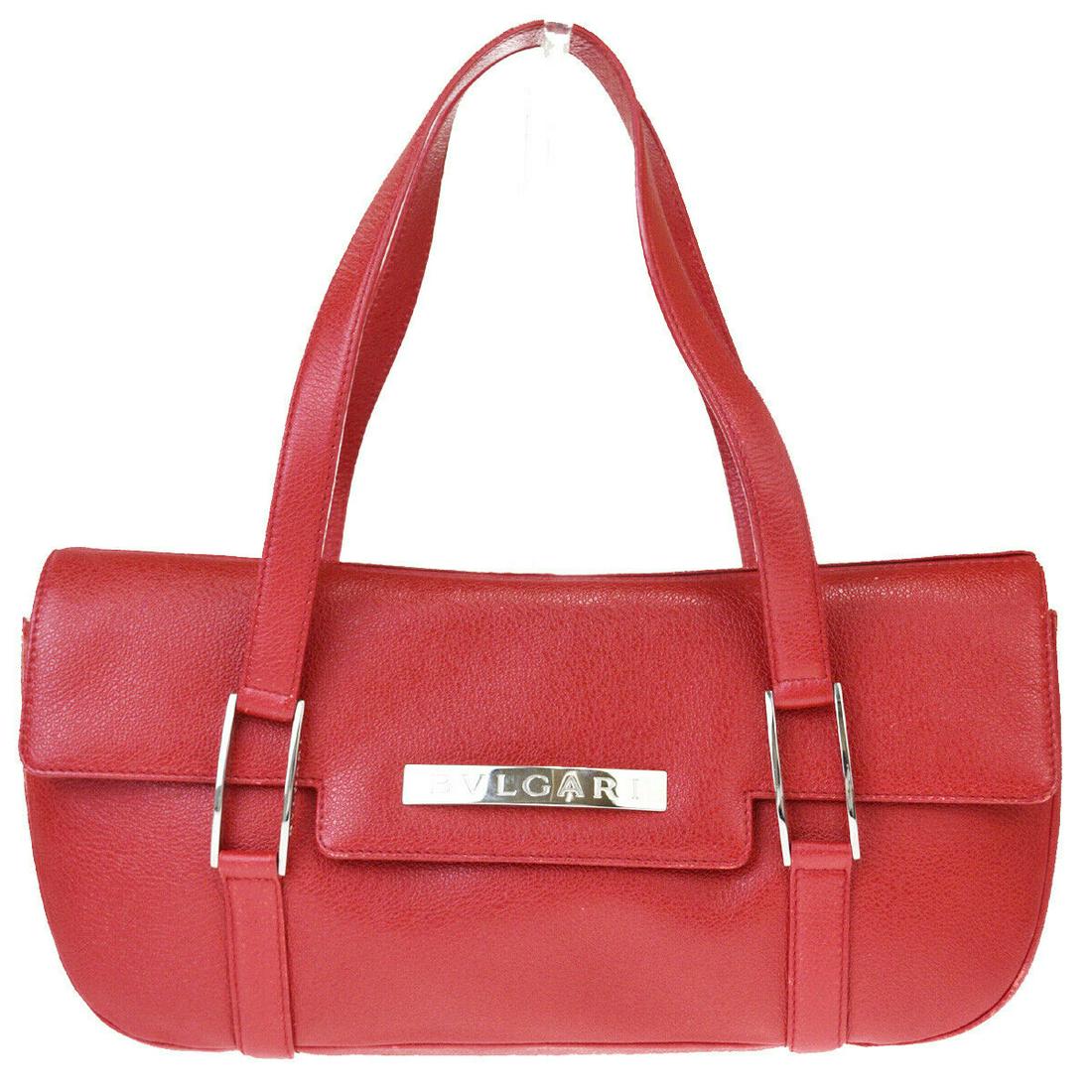 Authentic BVLGARI Leather Shoulder Bag: Brand: BVLGARI Material: Leather Style: Shoulder Bag Color: Red Size(inch): W 13.4 x H 6.3 x D 3.1 "(approx.) Country of Origin: Italy Come with: - All Bidhaus items come with a 100% money-back authen
