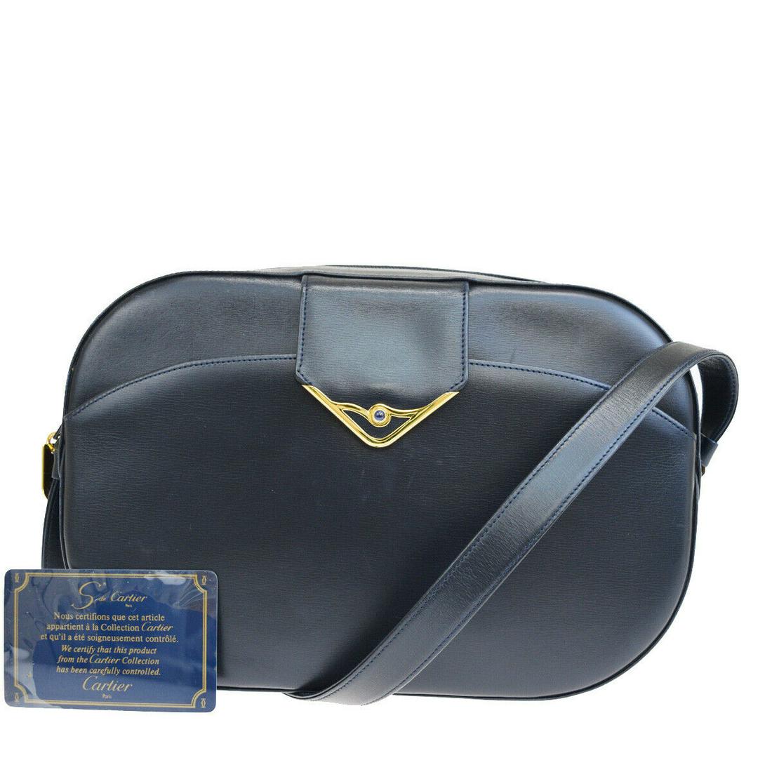 Authentic CARTIER Leather Shoulder bag: Brand: CARTIER Material: Leather Style: Shoulder bag Color: Navy Blue Size(inch): W 9.8 x H 6.3 x D 2 "(approx.) Country of Origin: - Come with: - All Bidhaus items come with a 100% money-back authent