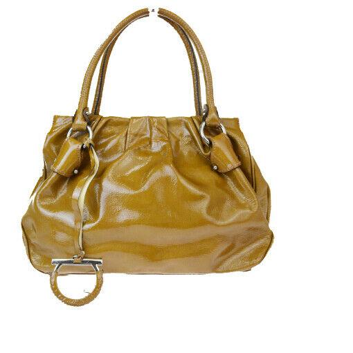 Authentic SALVATORE FERRAGAMO Patent leather Handbag: Brand: SALVATORE FERRAGAMO Material: Patent leather Style: Handbag Color: Brown Size (HxWxD): 21cm x 29cm x 10cm / 8.26'' x 11.41'' x 3.93'' Country of Origin: Italy All Bidhaus items come with a 100%