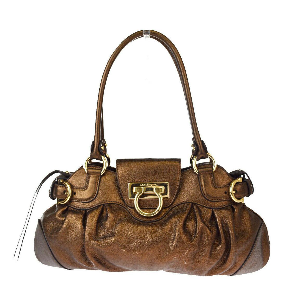 Authentic SALVATORE FERRAGAMO Leather Shoulder Bag: Brand: SALVATORE FERRAGAMO Material: Leather Style: Shoulder Bag Color: Bronze Size(inch): W 14.6 x H 7.5 x D 1.2 "(approx.) Country of Origin: Italy Come with: - All Bidhaus items come with a 100% mo
