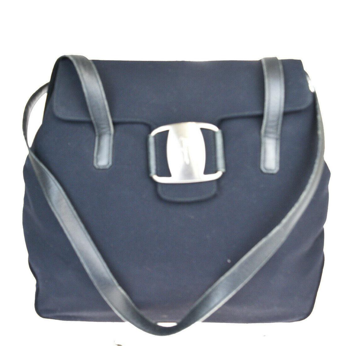 Authentic SALVATORE FERRAGAMO Canvas, Leather Shoulder: Brand: SALVATORE FERRAGAMO Material: Canvas, Leather Style: Shoulder bag Color: Black Size (HxWxD): 26cm x 30cm x 9cm / 10.23'' x 11.81'' x 3.54'' Country of Origin: Italy All Bidhaus items come with