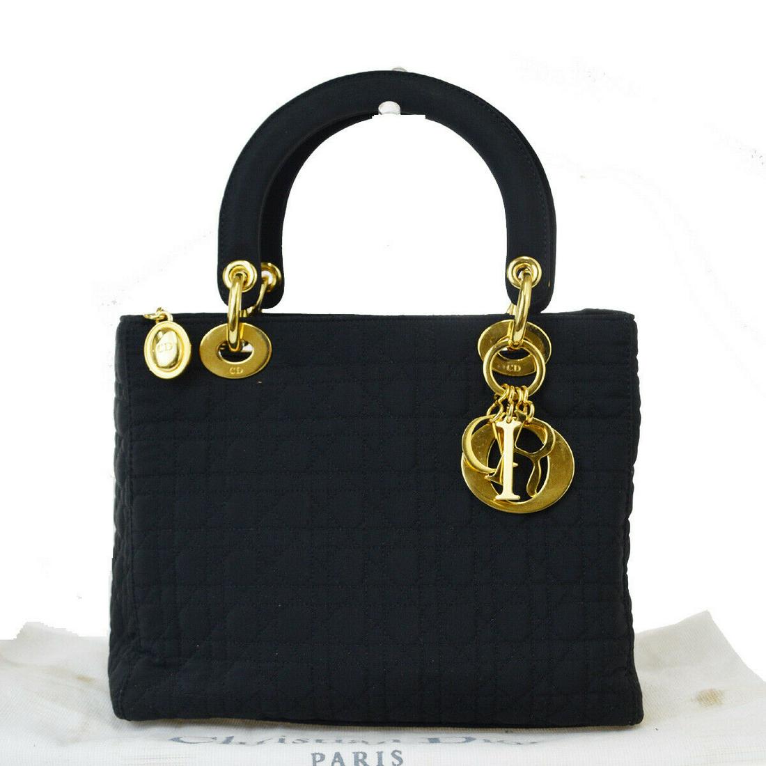 Authentic CHRISTIAN DIOR Suede Skin Leather Hand Bag: Brand: CHRISTIAN DIOR Material: Suede Skin Leather Style: Hand Bag Color: Black Size(inch): W 9.4 x H 7.5 x D 4.3 "(approx.) Country of Origin: italy Come with: - All Bidhaus items come with a 100% mo