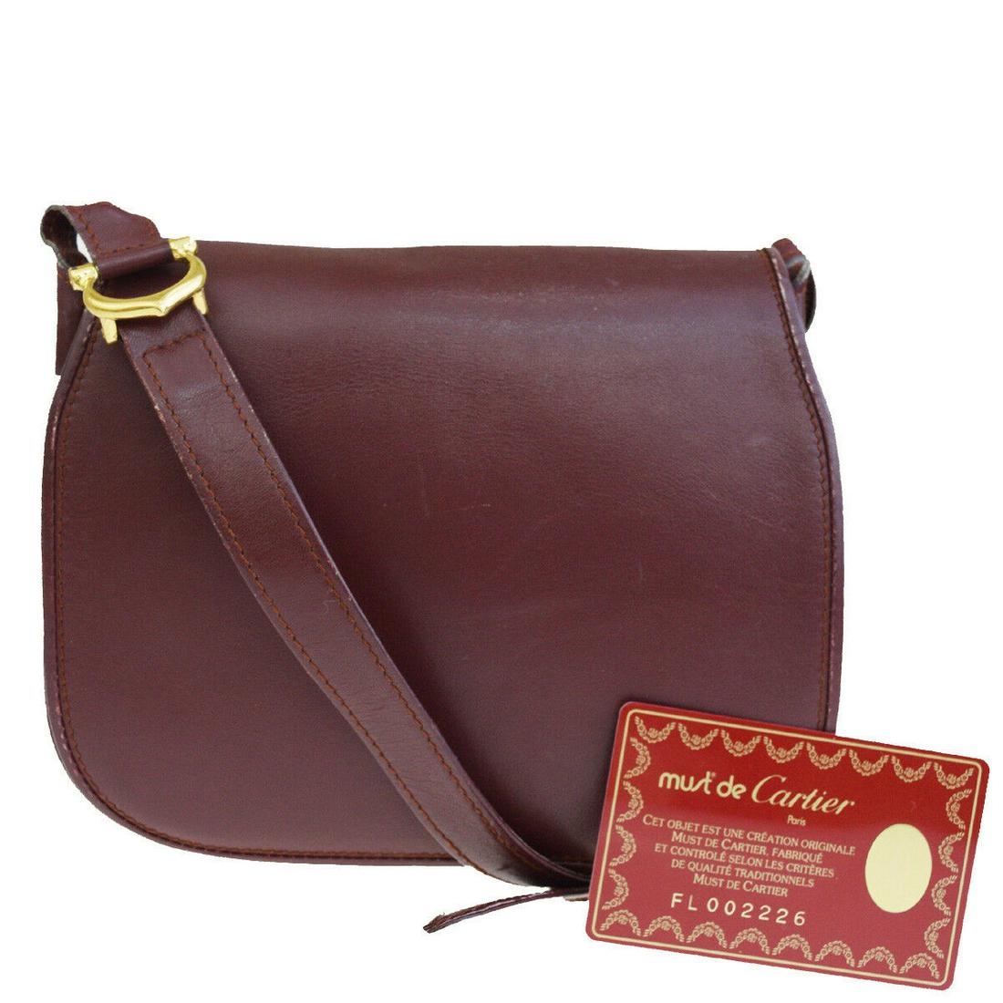 Authentic CARTIER Shoulder Bag: Brand: CARTIER Style: Shoulder Bag Color: Bordeaux Size(inch): W 6.7 x H 5.9 x D 1.6 "(approx.) Country of Origin: Italy Come with: Authenticity Card All Bidhaus items come with a 100% money-back auth