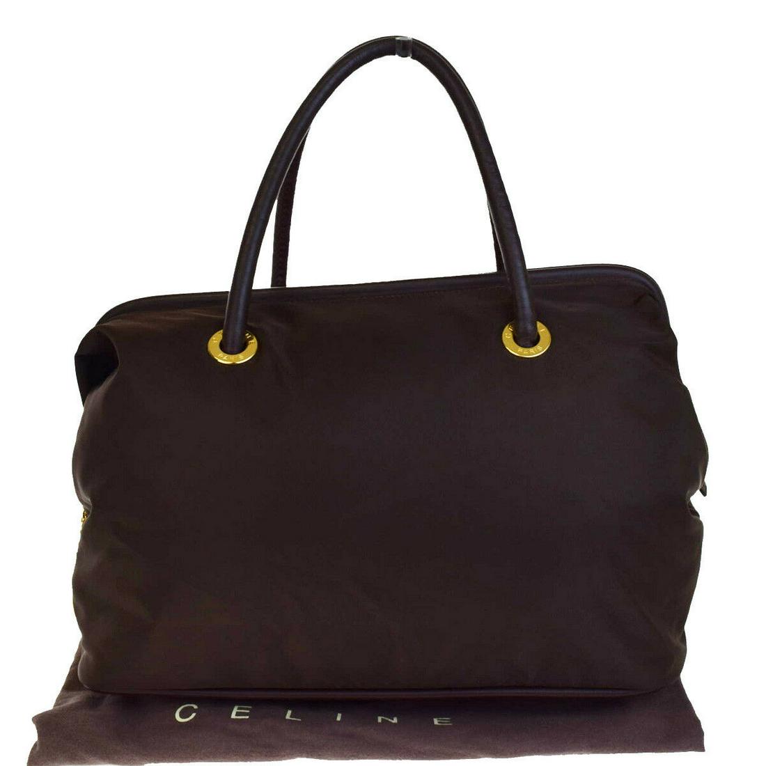 Authentic CELINE Leather Nylon Shoulder Bag: Brand: CELINE Material: Leather Nylon Style: Shoulder Bag Color: Brown Size(inch): W 15 x H 11.4 x D 7.9 "(approx.) Country of Origin: Italy Come with: Dust bag All Bidhaus items come with a 100% mone