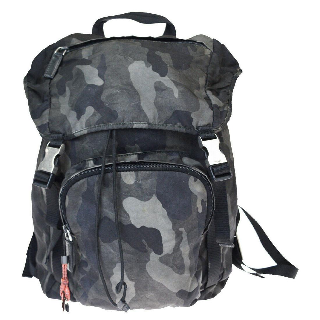 Authentic PRADA Nylon Leather Backpack Bag: Brand: PRADA Material: Nylon Leather Style: Backpack Bag Color: Black Khaki Size(inch): W 10.2 x H 16.5 x D 5.9 "(approx.) Country of Origin: Italy Come with: - All Bidhaus items come with a 100% mone