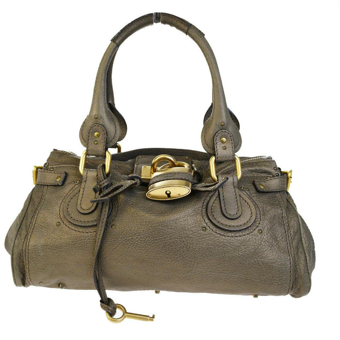 Authentic CHLOE Leather Shoulder Bag: Brand: CHLOE Material: Leather Style: Shoulder Bag Color: Bronze Size(inch): W 14.2 x H 7.5 x D 8.3 "(approx.) Country of Origin: Italy Come with: Padlock,Key, All Bidhaus items come with a 100% money