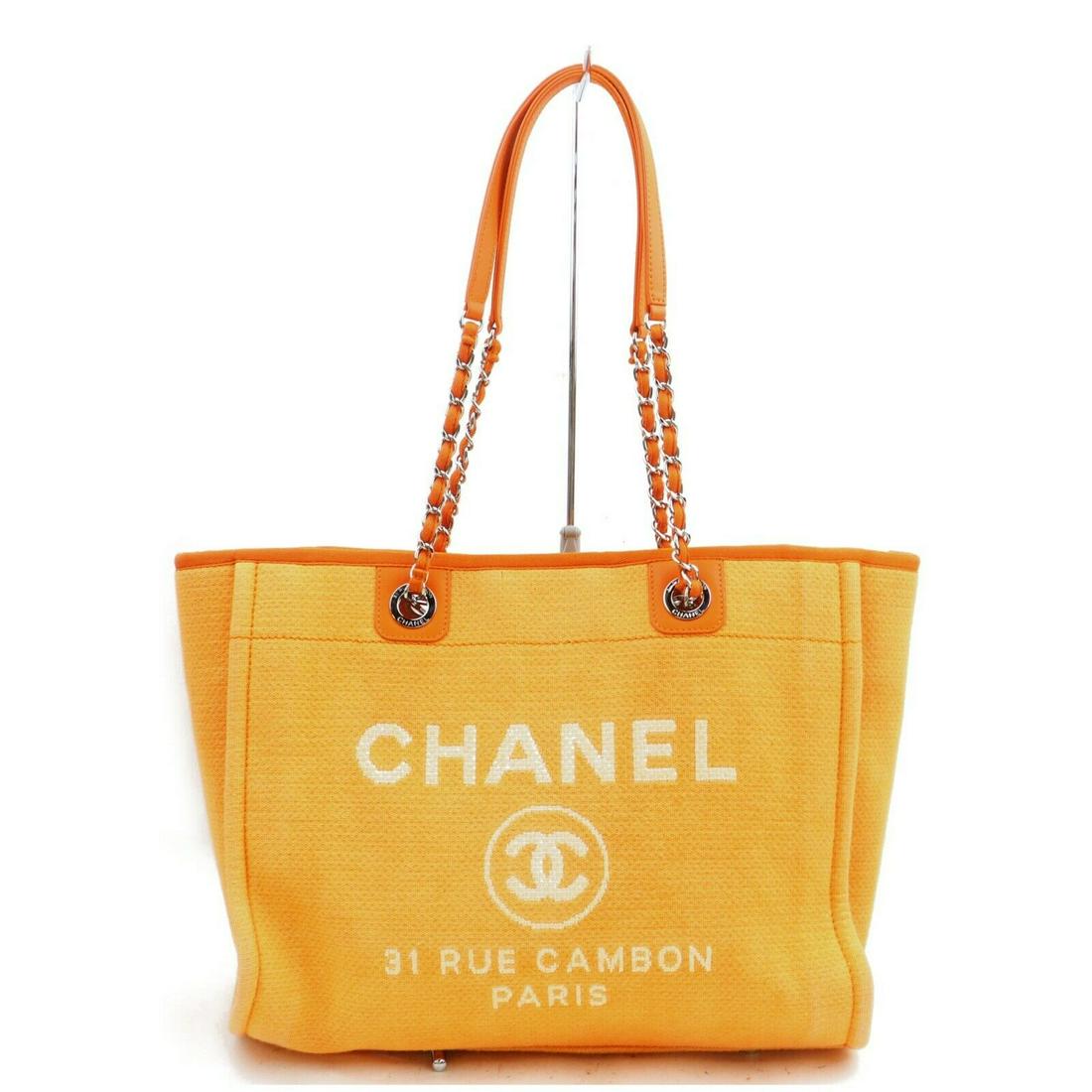 Authentic CHANEL Canvas Tote Bag: Brand: CHANEL Material: Canvas Style: Tote Bag Color: Oranges Size(inch): W13.7 inch(approx) /35 cm(approx) x H11.8 inch(approx) /30 cm(approx) x D3.93 inch(approx) /10 cm(approx) " / Strap Drop: Shou