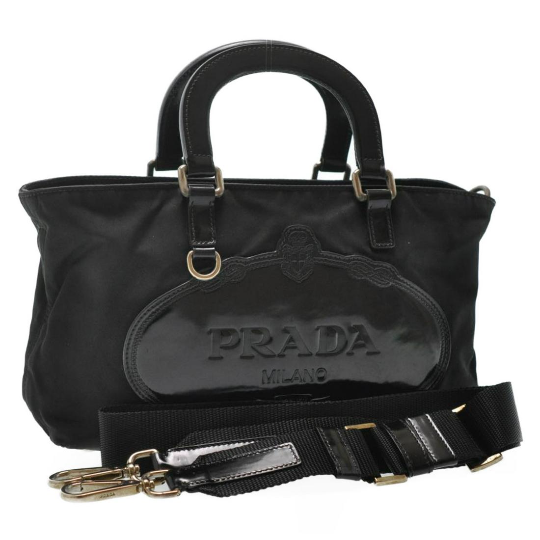 Authentic Prada Nylon 2Way Hand Bag Shoulder Bag: Brand: Prada Style: Hand Bag/ Shoulder Bag Material: Nylon Color: Black Made In: Italy Size (Inches): W10.23 X H5.51 X D3.14Inch / Shoulder Length 43.3Inch(Approx) Exterior Condition: Nylon : Stain, m