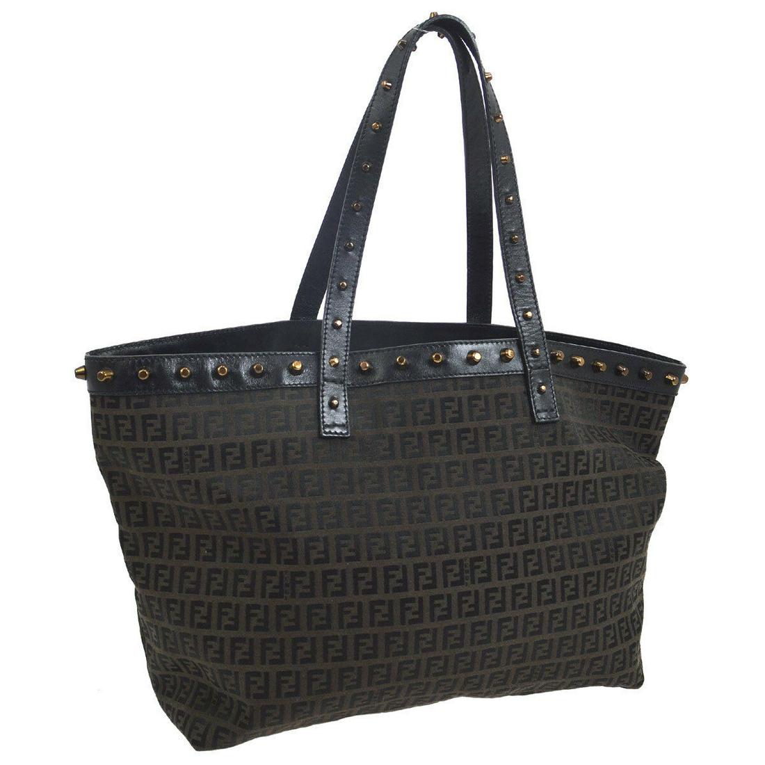 Authentic FENDI Canvas, Leather Hand Tote Bag: Brand: FENDI Material: Canvas, Leather Style: Hand Tote Bag Color: Dark Brown, Black Size(inch): W13.0 x H10.6 x D5.9 " / Strap Drop: 8.3 Country of Manufacture: Italy Come with: - All Bidhaus items c