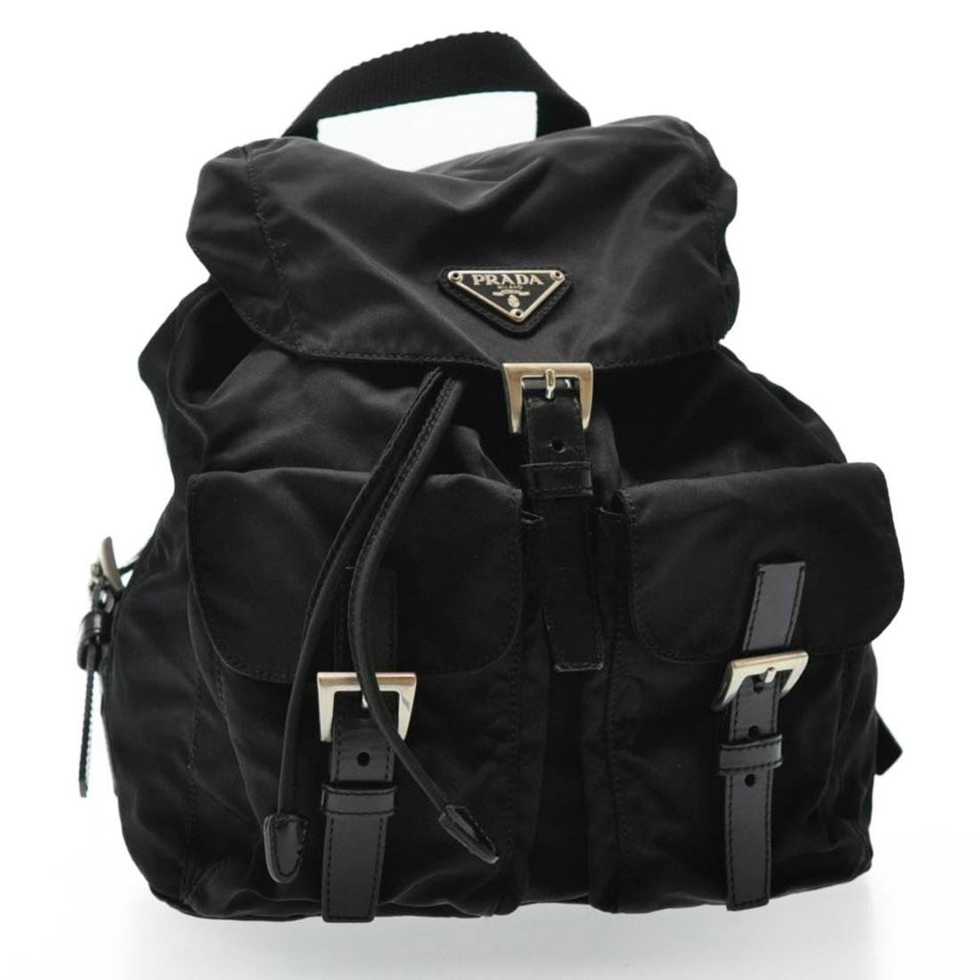 Authentic Prada Nylon Backpack: Brand: Prada Style: Backpack Material: Nylon Color: Black Made In: Italy Size (Inches): W9.44 X H10.62 X D4.72Inch(Approx) Exterior Condition: Nylon : loose Shape, Rubbing, Stain Shoulder : Minor Rubb
