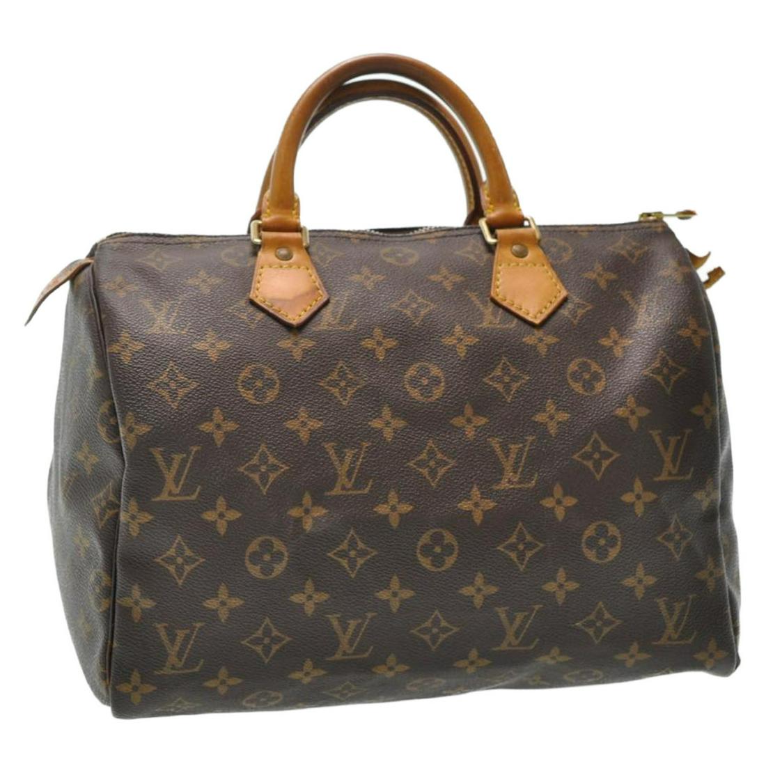 Authentic Louis Vuitton Monogram Speedy 30 Hand Bag: Brand: Louis Vuitton Style: Hand Bag Material: Monogram Canvas Color: Monogram Made In: France Size (Inches): W12 X H9 X D6.5"(Approx) Exterior Condition: Monogram Canvas : loose Shape, Rubbing Leathe
