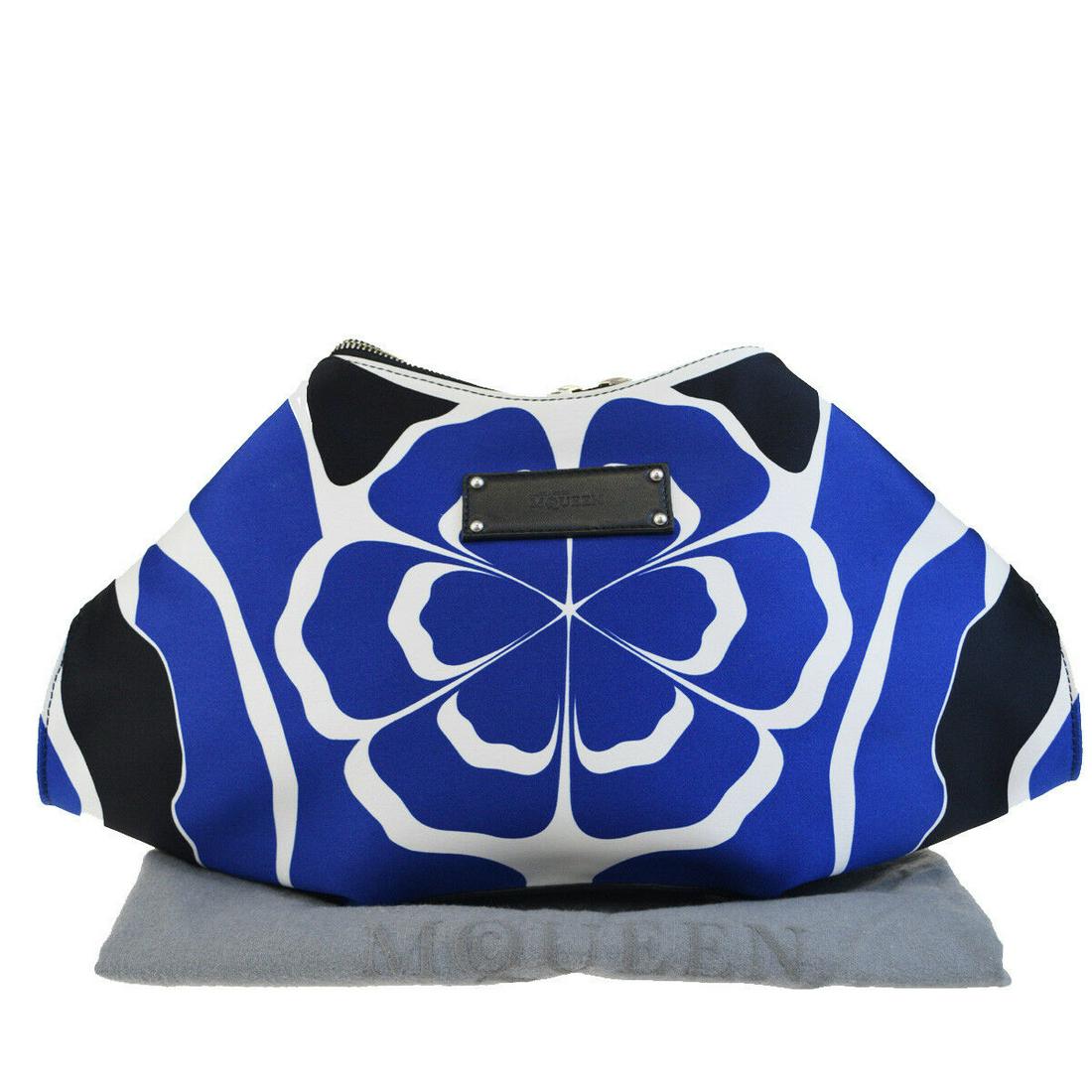 Authentic ALEXANDER MCQUEEN Leather Nylon Clutch: Brand: ALEXANDER MCQUEEN Material: Leather Nylon Style: Clutch Color: Blue Size(inch): W 14.6 x H 9.4 x D 2 "(approx.) Country of Origin: Italy Come with: Dust bag All Bidhaus items come with a 100% m