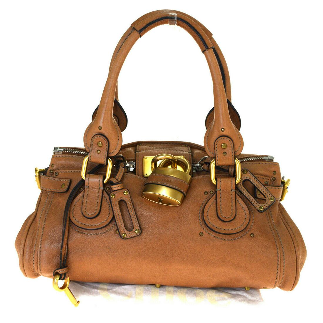 Authentic CHLOE Leather Shoulder Bag: Brand: CHLOE Material: Leather Style: Shoulder Bag Color: Brown Size(inch): W 13.8 x H 6.7 x D 7.9 "(approx.) Country of Origin: Italy Come with: Padlock,Key,Authenticity Card All Bidhaus items come w