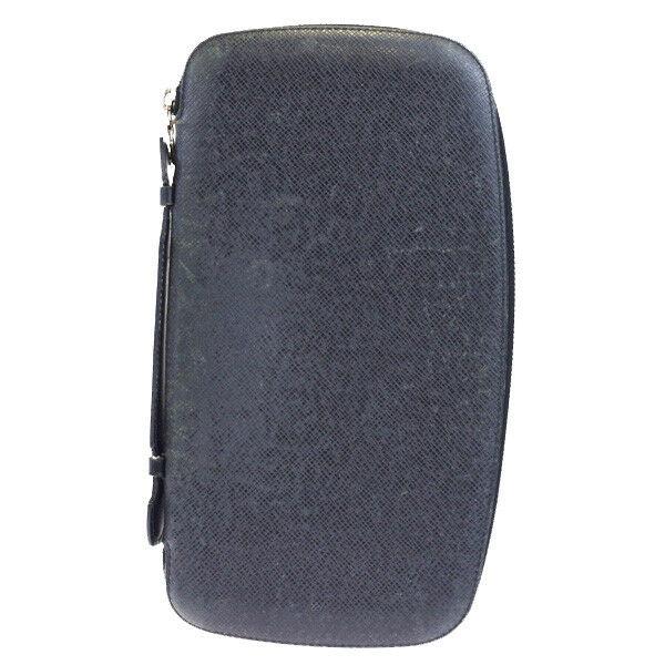 Authentic LOUIS VUITTON Taiga Leather Wallet: Brand: LOUIS VUITTON Material: Taiga Leather Style: Wallet Color: Green Size(inch): W 5.9 x H 10.6 x D 0 "(approx.) Country of Origin: France Come with: - All Bidhaus items come with a 100% money-back