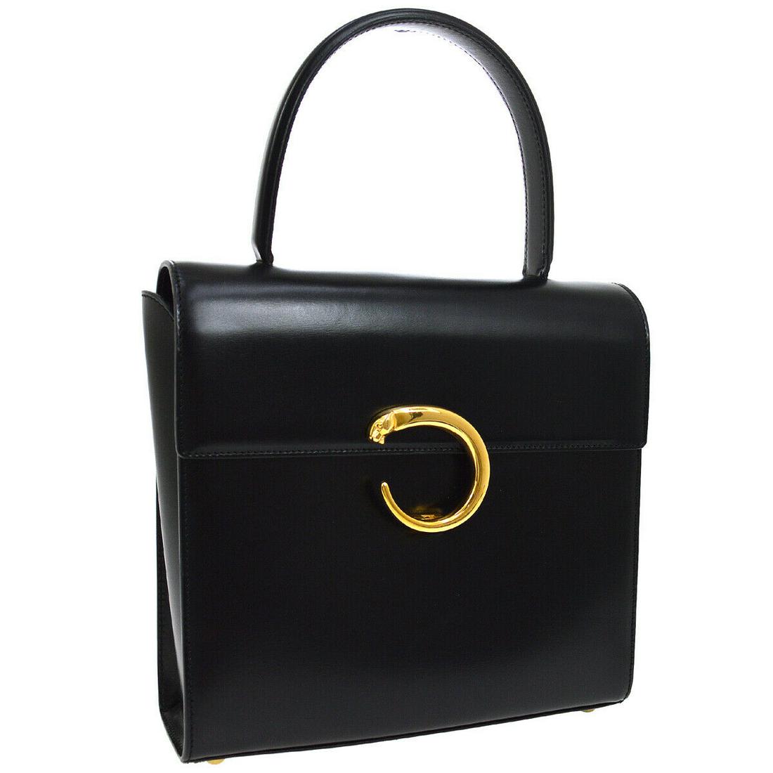 Authentic CARTIER Leather Hand Bag: Brand: CARTIER Material: Leather Style: Hand Bag Color: Black Size(inch): W8.7 x H8.1 x D2.8 " / Strap Drop: 4.3 Country of Manufacture: Italy Come with: Shoulder Strap, Dust Bag All Bidhaus items com
