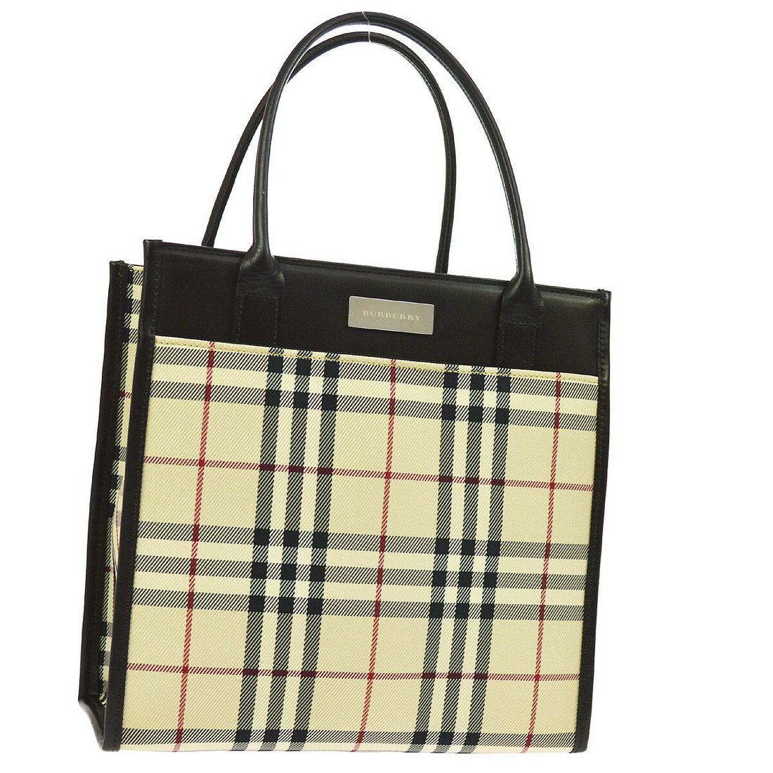 Authentic BURBERRY Nylon, Leather Hand Bag: Brand: BURBERRY Material: Nylon, Leather Style: Hand Bag Color: Beige, Brown, Black, Red Size(inch): W8.9 x H8.7 x D4.1 " Country of Manufacture: Unknown Come with: - All Bidhaus items come with a 100