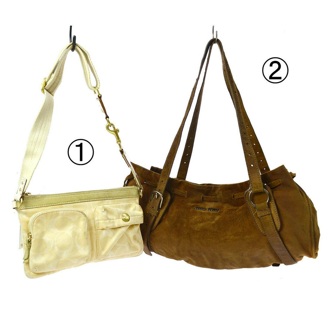 Authentic COACH, MIUMIU Suede, Leather Bag: Brand: COACH, MIUMIU Material: Suede, Leather Style: Bag Color: Brown Size(inch): W 17.7 x H 9.1 x D 2.8 " Strap Drop. 16.9 "(Longest) Come with: - All Bidhaus items come with a 100% money-back authen