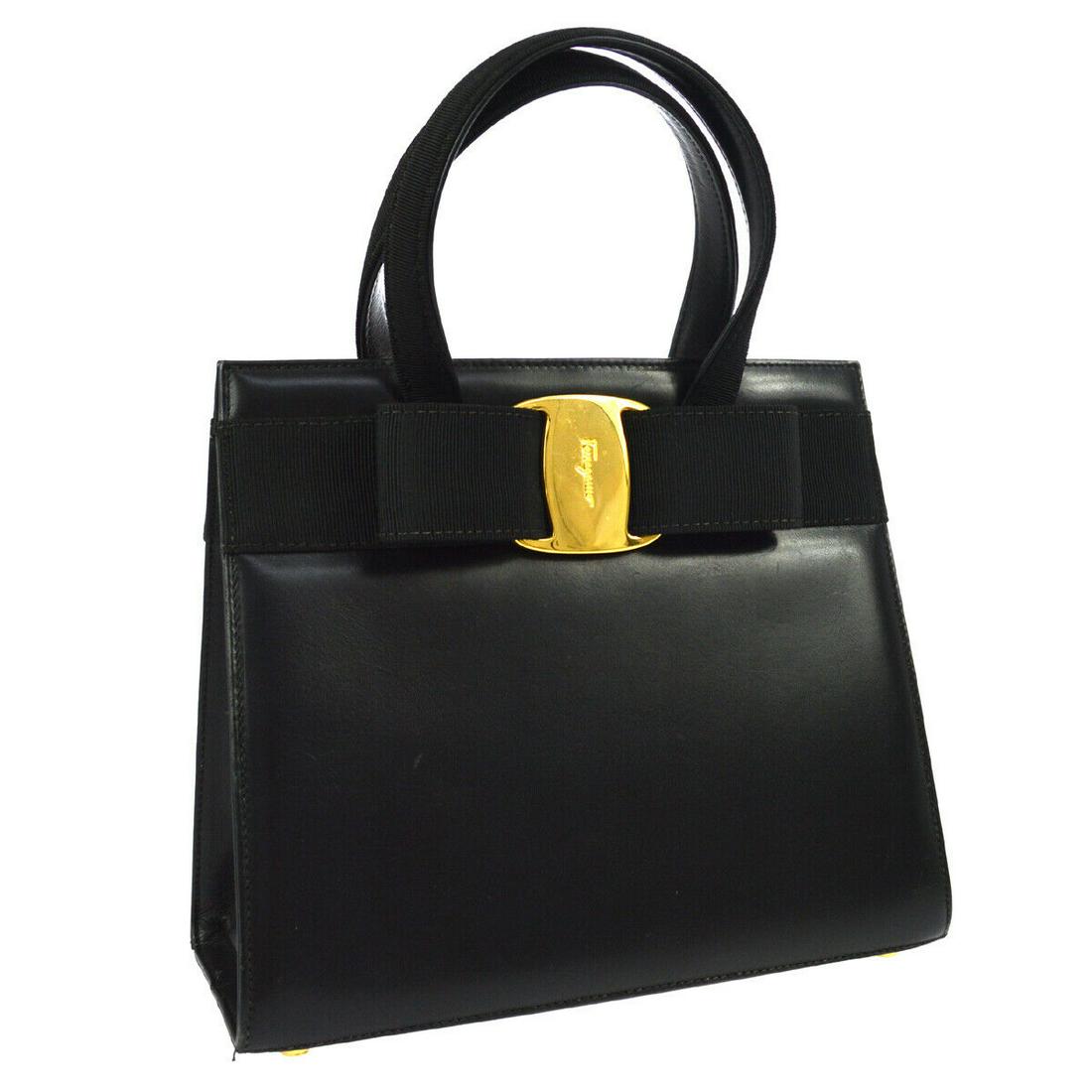 Authentic SALVATORE FERRAGAMO Leather Hand Bag: Brand: SALVATORE FERRAGAMO Material: Leather Style: Hand Bag Color: Black Size(inch): W9.3 x H8.3 x D3.5 " / Strap Drop: 3.9 Size(inch): W 9.3 x H 8.3 x D 3.5 " Handle Drop. 3.9 " Country of Origin: I