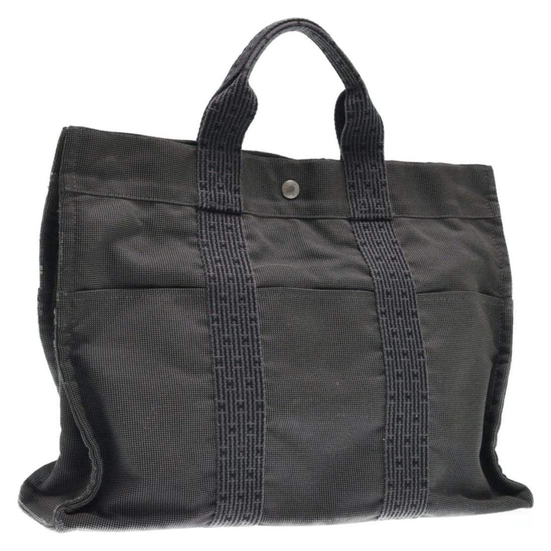 Authentic HERMES 69% Polyamide / 31% Polyester Tote Bag: Brand: HERMES Material: 69% polyamide / 31% Polyester Style: Tote Bag Color: Gray Size(inch): W16.5 x H11.8 x D3.9â€³(Approx) Country of Origin: France Accessory: There is no item box and dust bag