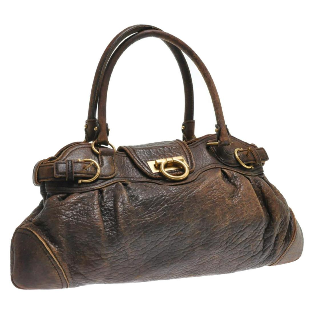 Authentic SALVATORE FERRAGAMO Leather Tote Bag: Brand: SALVATORE FERRAGAMO Material: Leather Style: Tote Bag Color: Brown Size(inch): W17.71 x H9.84inch / Handle Drop 7.08inch(Approx) Country of Origin: Italy Accessory: There is no item box and dus