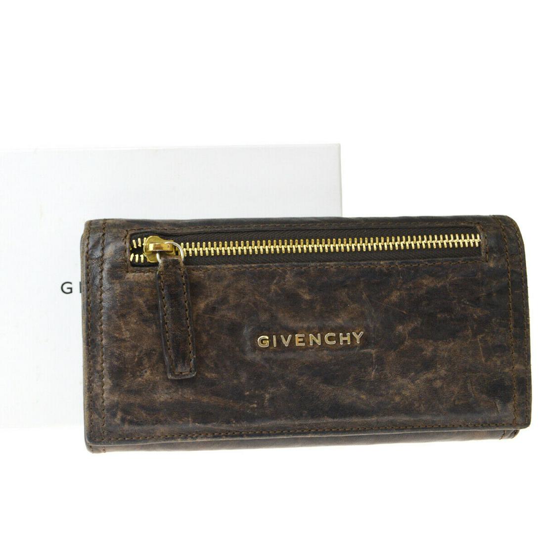 Authentic GIVENCHY Leather Wallet: Brand: GIVENCHY Material: Leather Style: Wallet Color: Brown Size(inch): W 7.5 x H 3.9 x D 0 "(approx.) Country of Origin: Spain Come with: Box All Bidhaus items come with a 100% money-back authentici