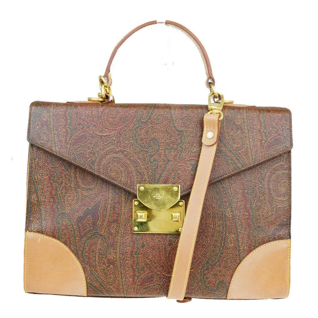 Authentic ETRO PVC, Leather Handbag: Brand: ETRO Material: PVC, Leather Style: Handbag Color: Bordeaux Size (HxWxD): 23cm x 32cm x 10cm / 9.05'' x 12.59'' x 3.93'' Country of Origin: Italy All Bidhaus items come with a 100% money-back au