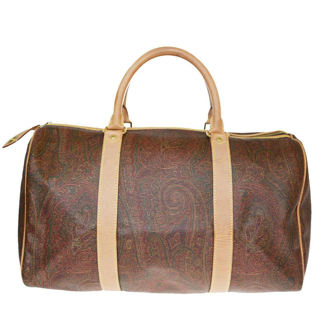 Authentic ETRO PVC, Leather Handbag: Brand: ETRO Material: PVC, Leather Style: Handbag Color: Bordeaux Size (HxWxD): 24cm x 39cm x 21cm / 9.44'' x 15.35'' x 8.26'' Country of Origin: Italy All Bidhaus items come with a 100% money-back au