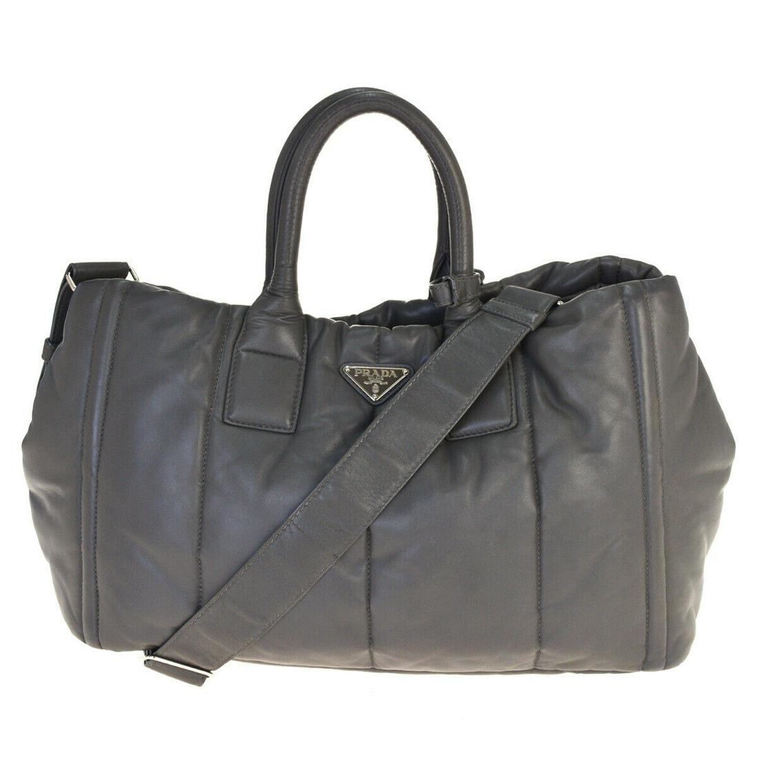 Authentic PRADA Leather, Nylon Hand Bag: Brand: PRADA Material: Leather, Nylon Style: Hand Bag Color: khaki Size(inch): W 15.7 x H 9.8 x D 7.9 "(approx.) Country of Origin: Italy Come with: - All Bidhaus items come with a 100% money-back aut
