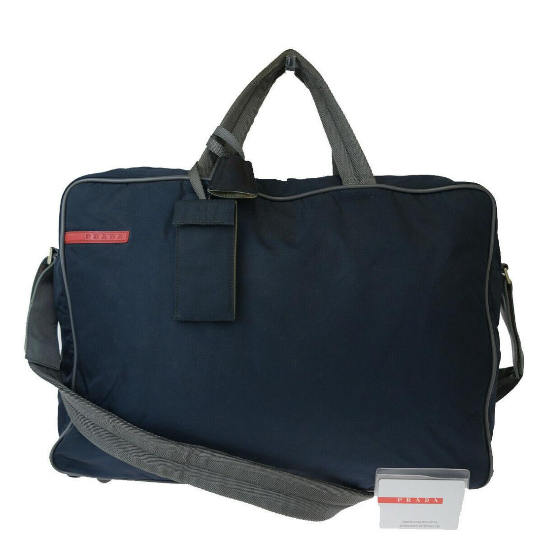 Authentic PRADA Nylon Shoulder Hand Bag: Brand: PRADA Material: Nylon Style: Shoulder Hand Bag Color: Navy Blue Size(inch): W 16.9 x H 11.8 x D 5.5 "(approx.) Country of Origin: Italy Come with: Authenticity Card,Name tag,Padlock,Key*2,Keybe