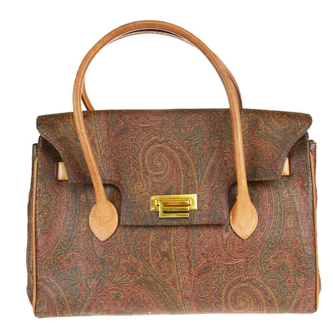 Authentic ETRO PVC, Leather Handbag: Brand: ETRO Material: PVC, Leather Style: Handbag Color: Bordeaux Size (HxWxD): 21cm x 32cm x 16cm / 8.26'' x 12.59'' x 6.29'' Country of Origin: Italy All Bidhaus items come with a 100% money-back au