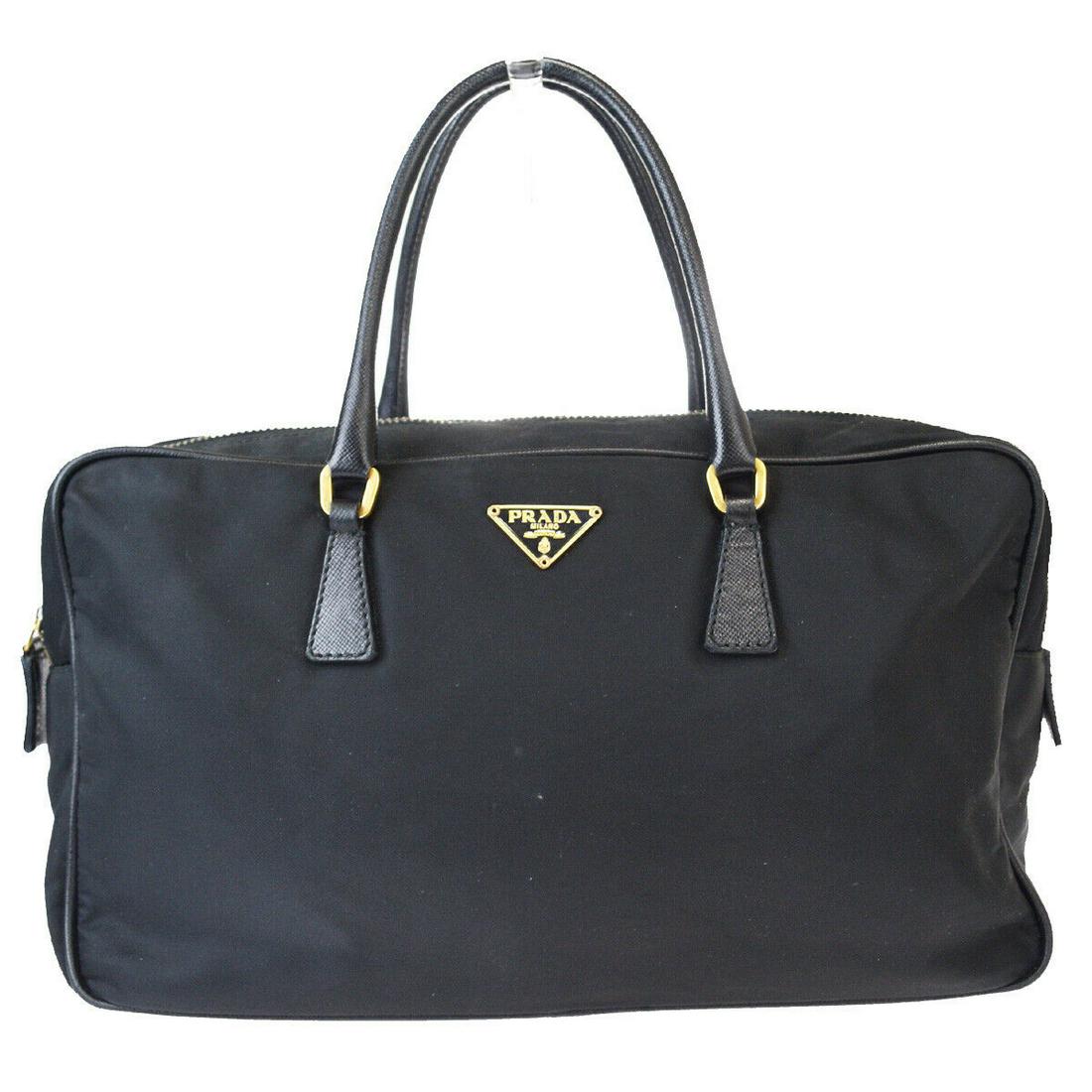 Authentic PRADA Leather, Nylon Hand Bag: Brand: PRADA Material: Leather, Nylon Style: Hand Bag Color: Black Size(inch): W 10.6 x H 6.3 x D 3.1 "(approx.) Country of Origin: Italy Come with: - All Bidhaus items come with a 100% money-back aut