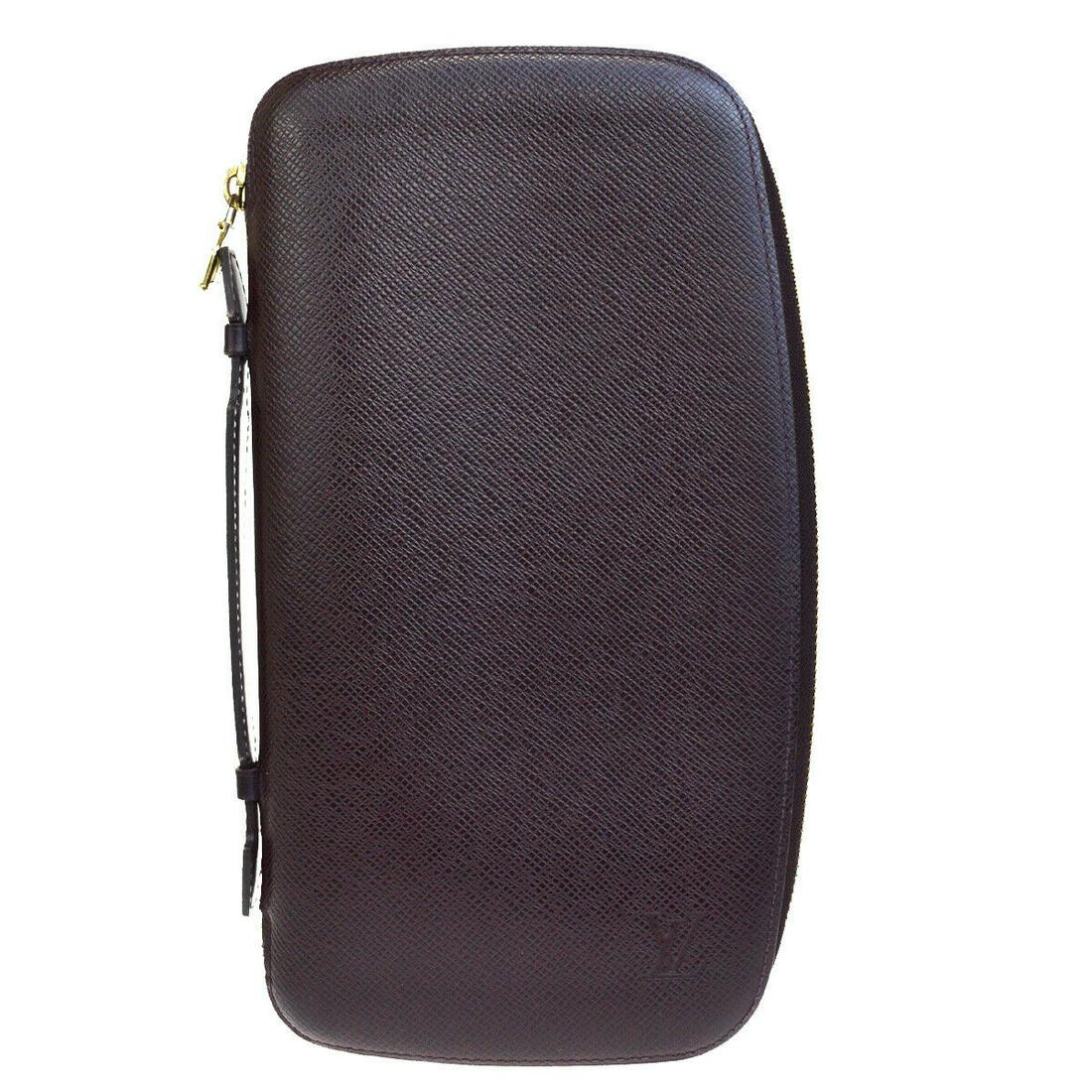 Authentic LOUIS VUITTON Taiga Leather Wallet: Brand: LOUIS VUITTON Material: Taiga Leather Style: Wallet Color: Bordeaux Size(inch): W 5.9 x H 10.2 x D 0 "(approx.) Country of Origin: France Come with: - All Bidhaus items come with a 100% money-b