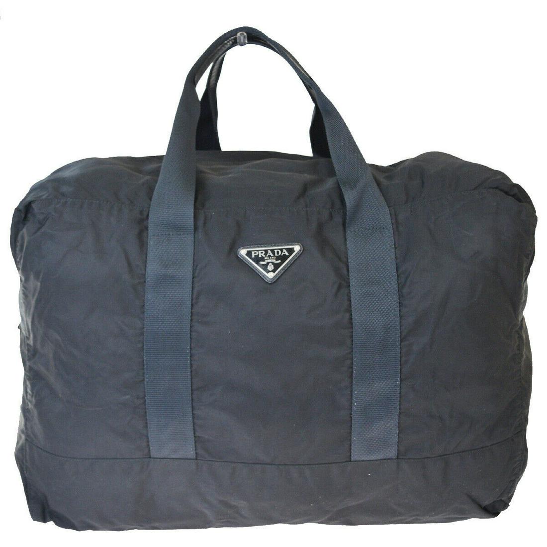 Authentic PRADA Leather, Nylon Hand Bag: Brand: PRADA Material: Leather, Nylon Style: Hand Bag Color: Black Size(inch): W 20.9 x H 14.6 x D 9.4 "(approx.) Country of Origin: Italy Come with: - All Bidhaus items come with a 100% money-back au